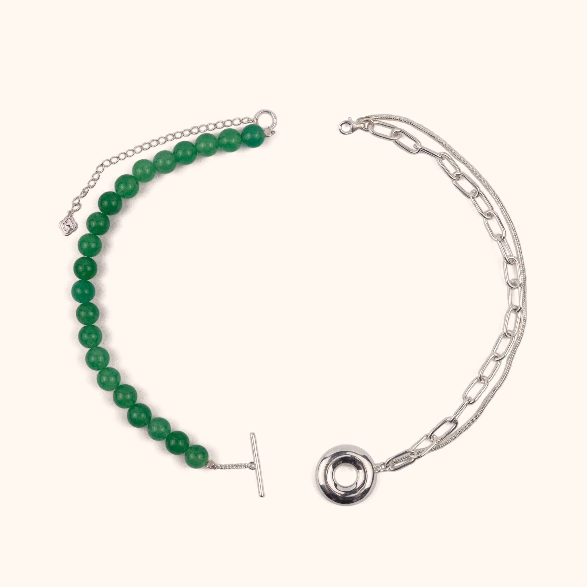 The Heaven and Earth necklace is a modern Chinese necklace with aventurine beads, silver mixed chain, and donut toggle clasp. It is a versatile modern Asian jewelry piece with a jade aesthetic that can be worn as a necklace or two bracelets.
