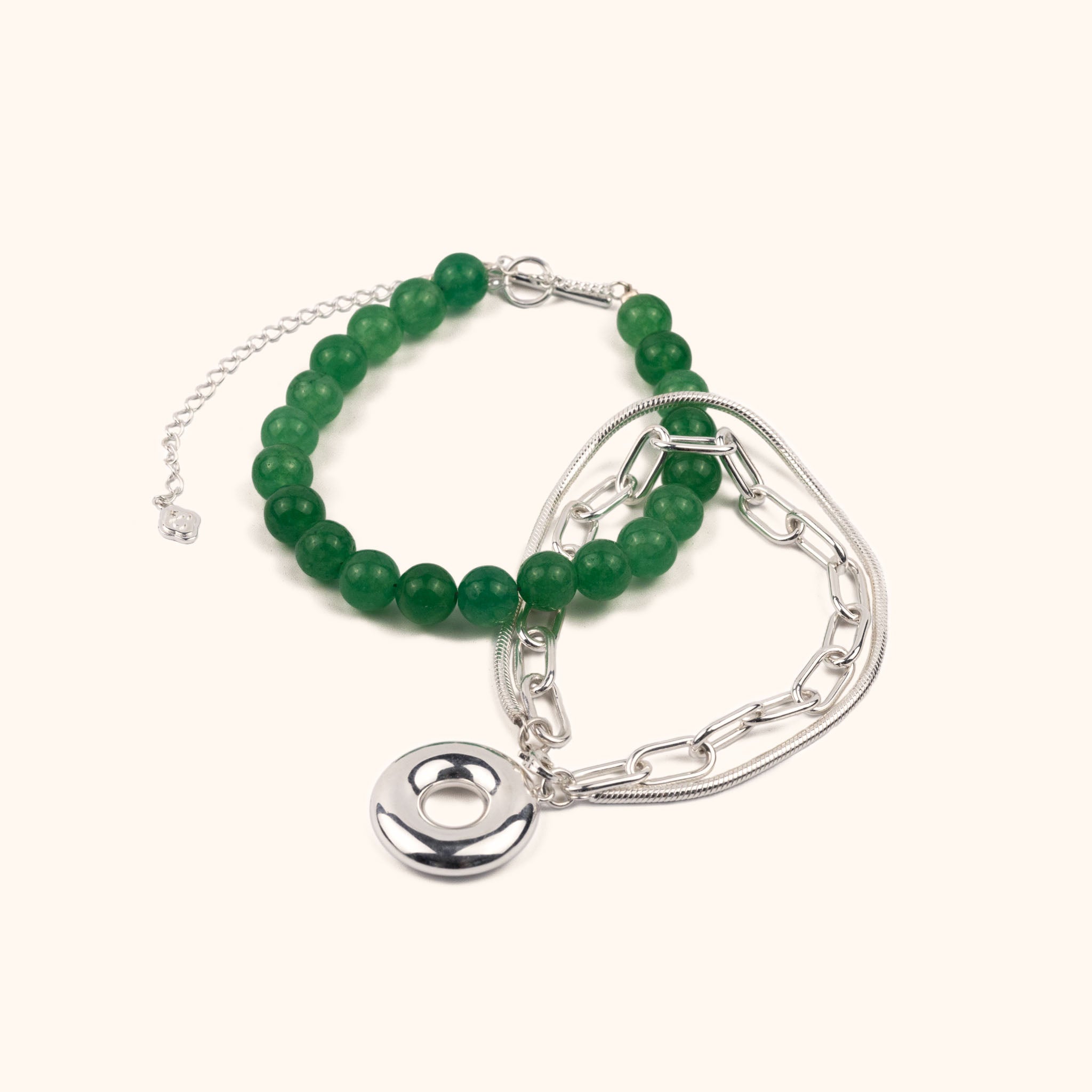 The Heaven and Earth necklace is a modern Chinese necklace with aventurine beads, silver mixed chain, and donut toggle clasp. It is a versatile modern Asian jewelry piece with a jade aesthetic that can be worn as a necklace or two bracelets.