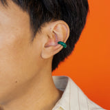 Man wearing modern Chinese jewelry: jade ear cuff