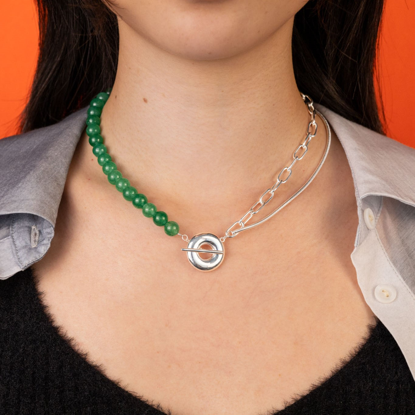 The Heaven and Earth necklace is a modern Chinese necklace with aventurine beads, silver mixed chain, and donut toggle clasp. It is a versatile modern Asian jewelry piece with a jade aesthetic that can be worn as a necklace or two bracelets.
