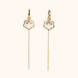Ruyi earrings with ruyi shaped charms outlined in gold and filled with pearlescent white enamel.