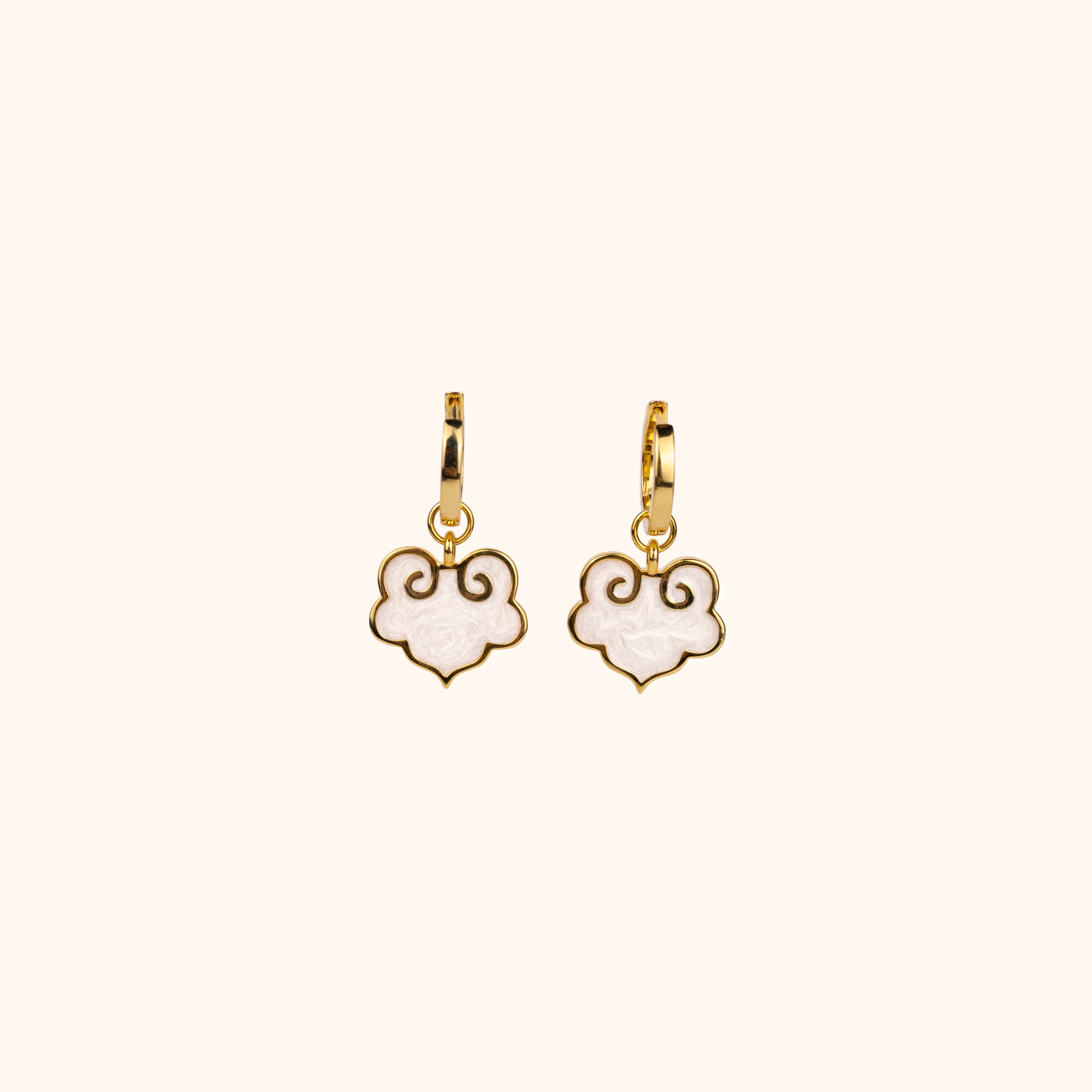 Ruyi earrings with ruyi shaped charms outlined in gold and filled with pearlescent white enamel.