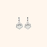 Ruyi earrings with ruyi shaped charms outlined in silver and filled with pearlescent white enamel.