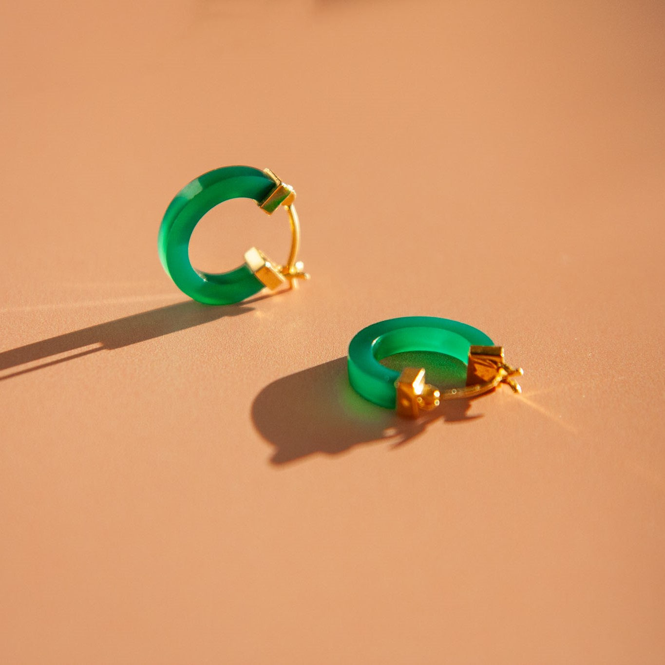 Modern Chinese jade aesthetic hoops with square cut green agate stone and choice of silver or gold clasps.