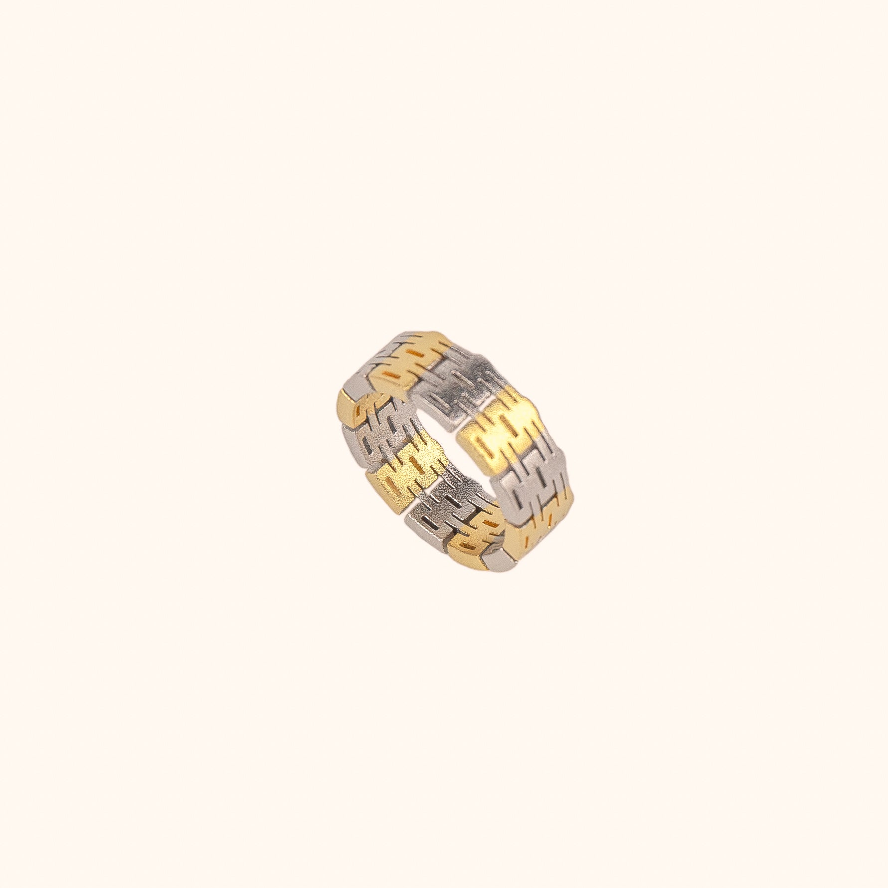 A two-tone, modern Chinese-inspired ring made of the Chinese happiness character, set on a white background.
